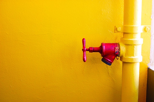 Yellow pipe with red valve. All pipelines should have safety features.
